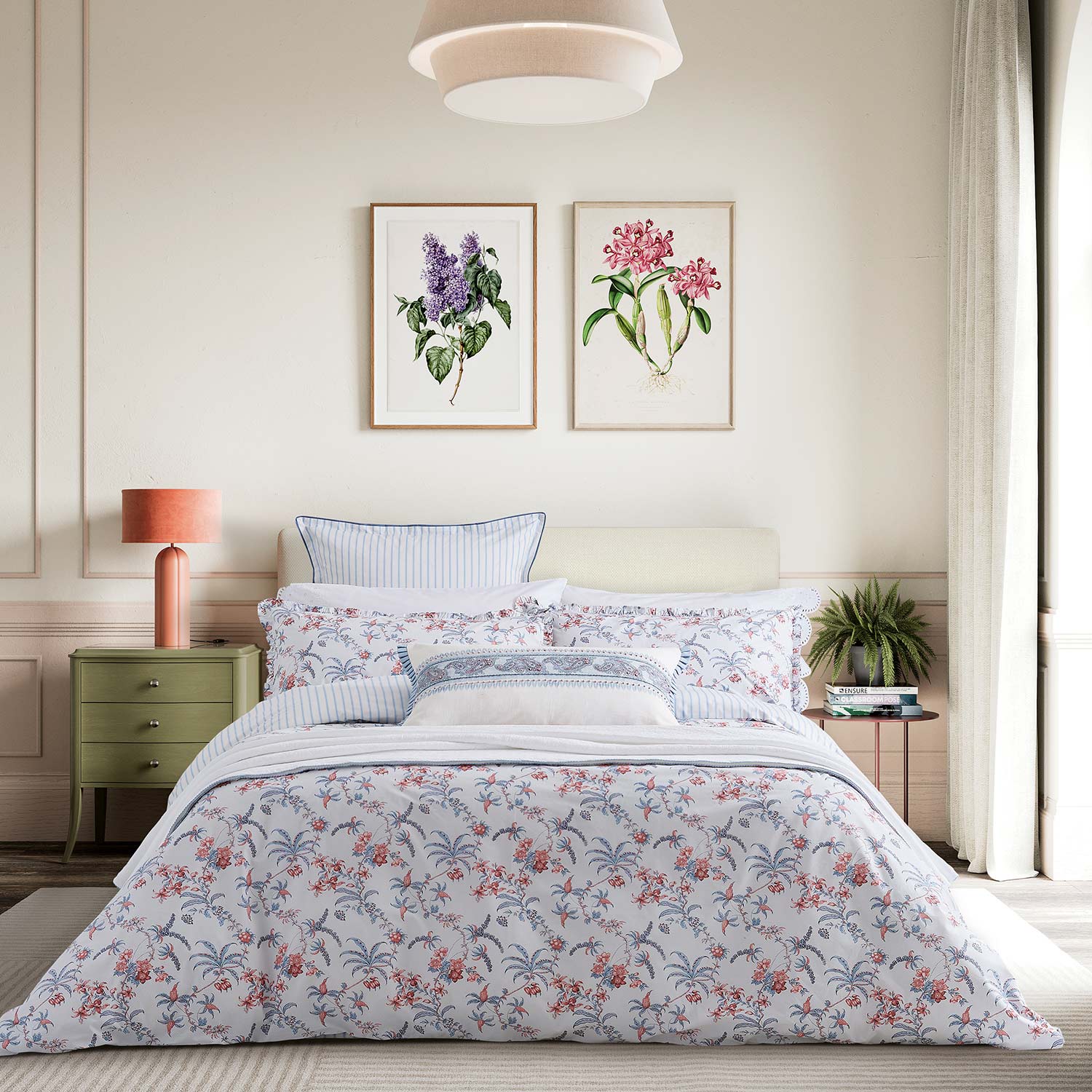 Bedroom pictured with floral bedsheets.