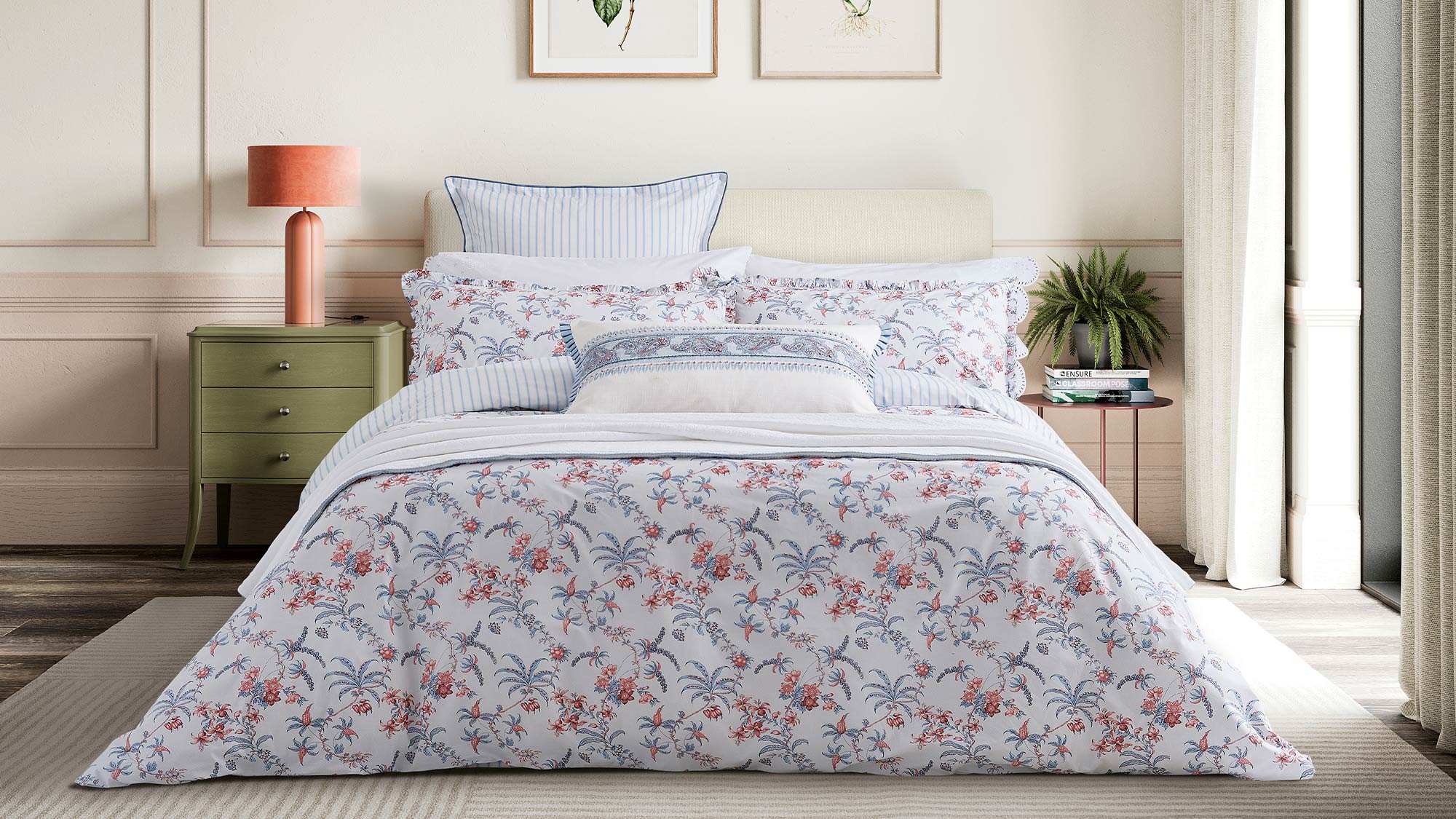 Bedroom pictured with floral bedsheets.