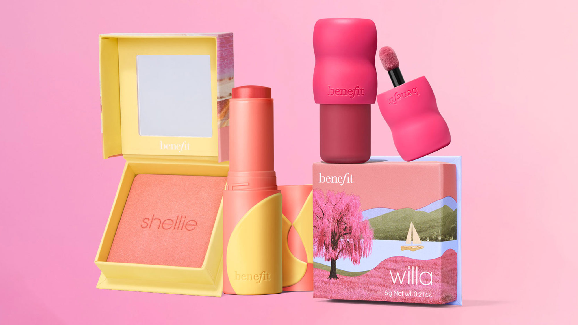 A collection of colorful Benefit cosmetics, including blush, lipstick, and eyeshadow, against a pink background.