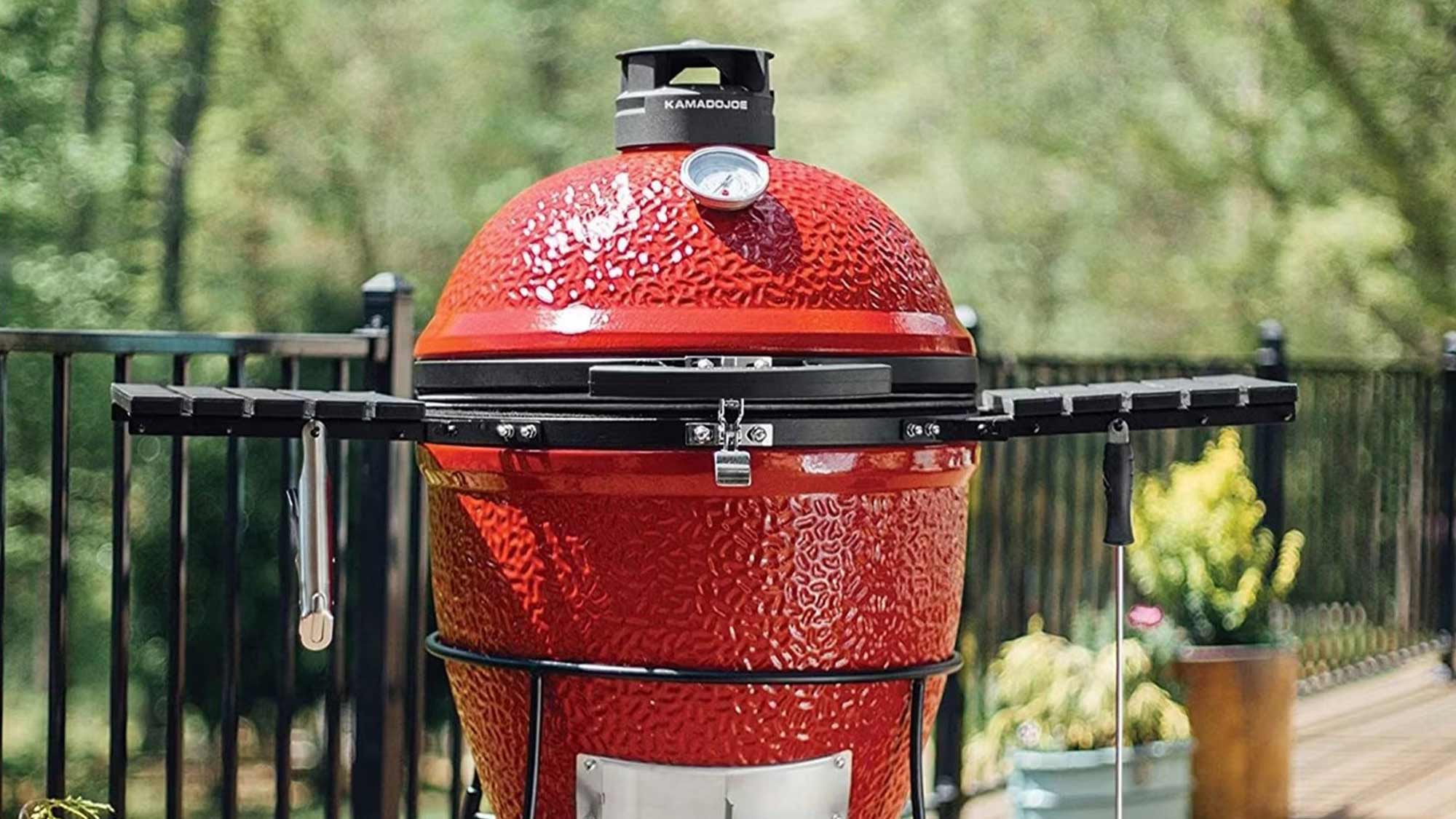 red kamado joe BBQ outdoors on patio