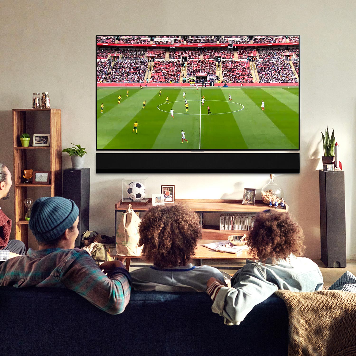 HD television displaying live football match in home living room