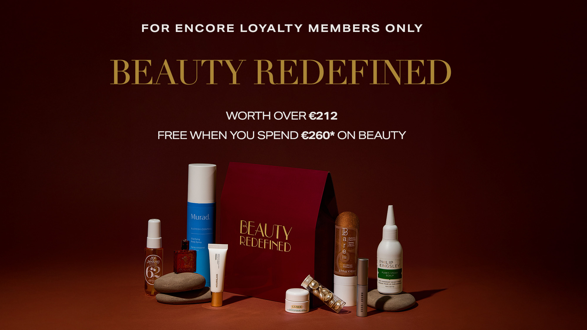 Beauty products arranged around a box labeled 'Beauty Redefined' with promotional text for loyalty members above.
