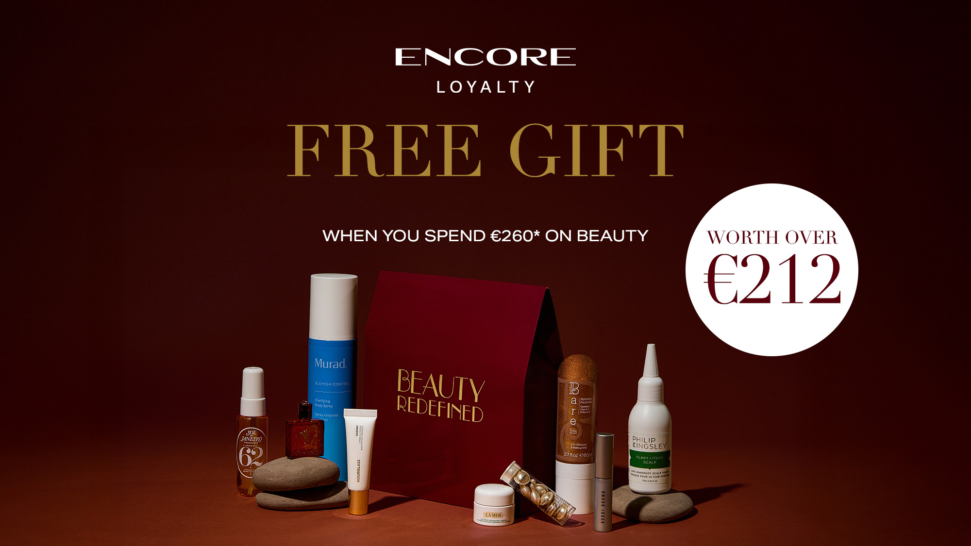 Assortment of beauty products displayed around a red box with the text 'Beauty Redefined.' Offer details printed above.