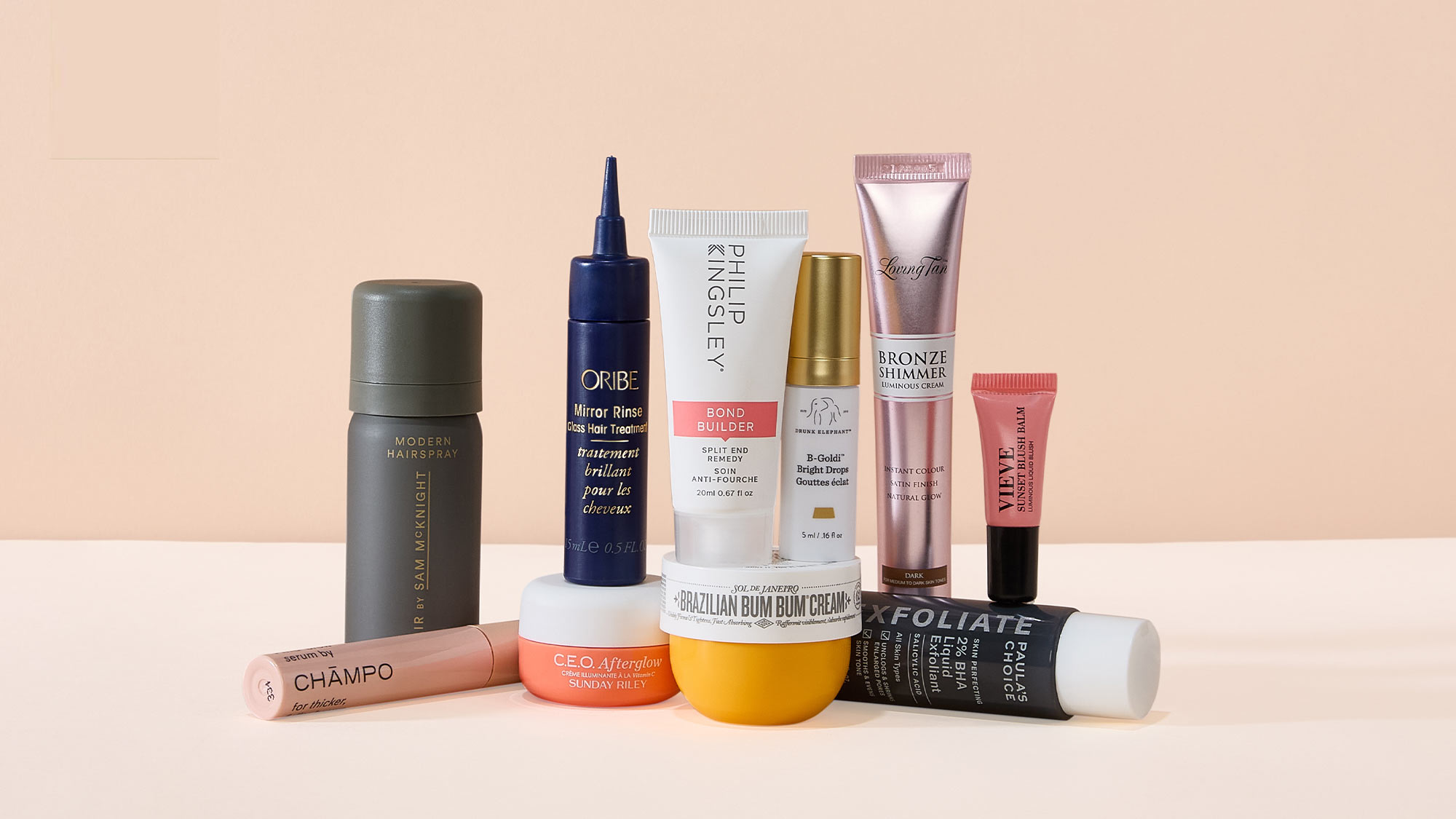 Three skincare products stacked: a bottle on top of a jar labeled 'Brazilian Bum Bum Cream,' which sits on a green jar 'The Ritual of Karma.'

