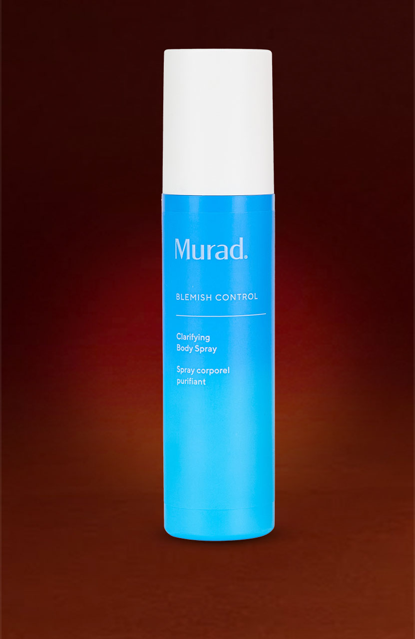A blue Murad 'Blemish Control' clarifying body spray bottle with a white cap on a dark gradient background.