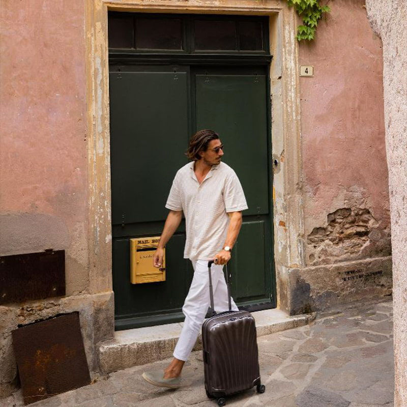 man walking with suitcase
