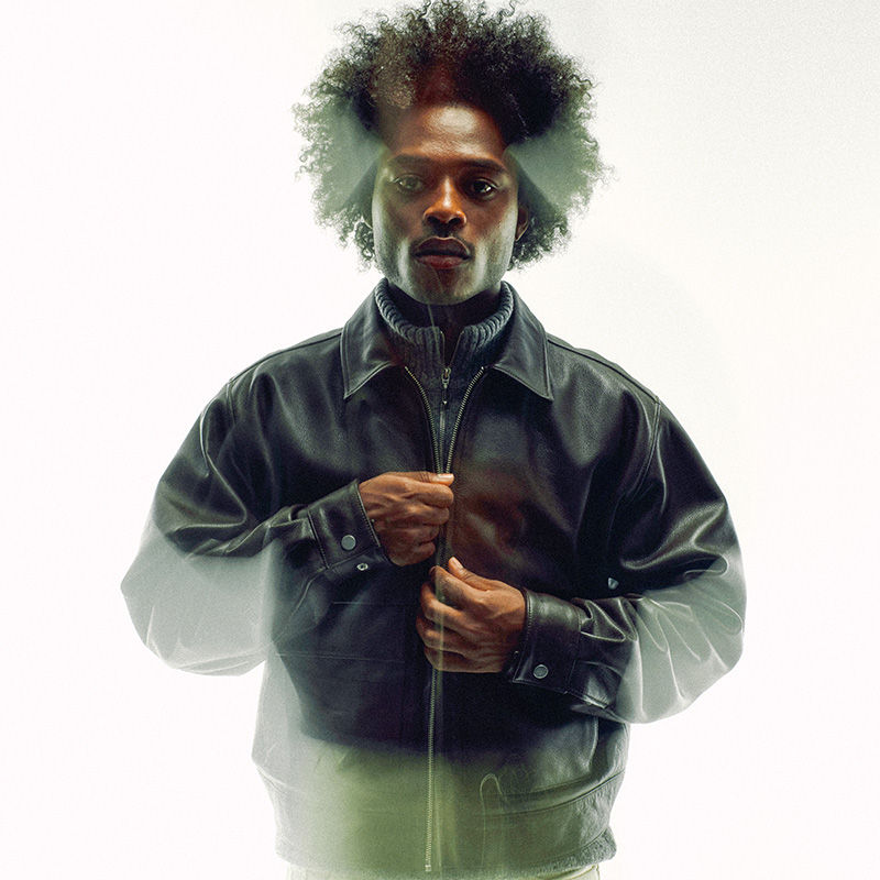 man wearing a black leather jacket