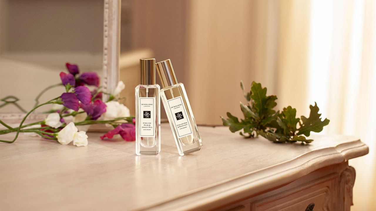 Jo Malone London fragrances next to a cup of tea