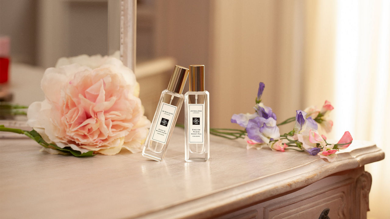 Jo Malone London fragrances next to a cup of tea