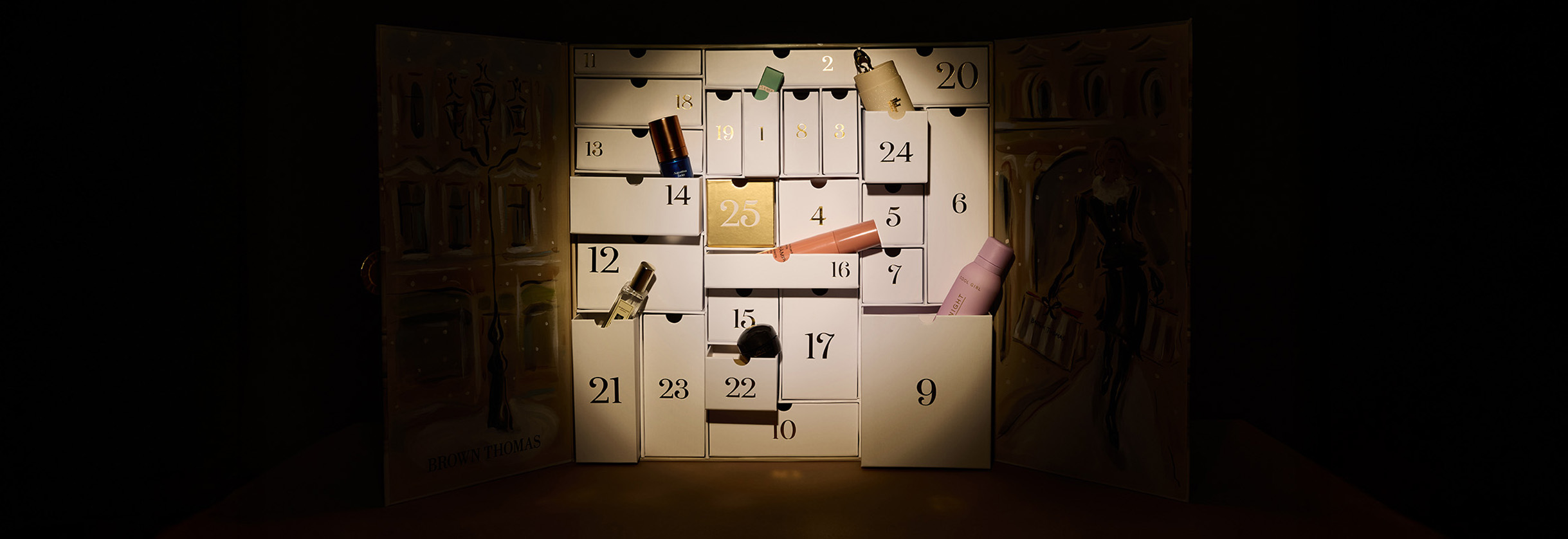 A lit advent calendar with numbered doors and illustrated background, revealing small items behind some doors.