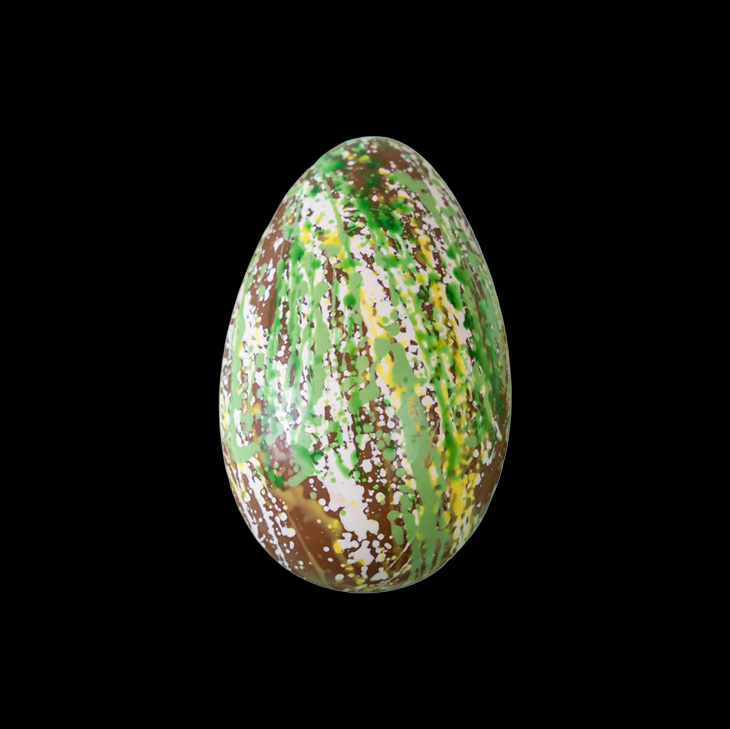 A person in a black outfit, including Spanx leggings, stands against a light wall on a wooden floor.