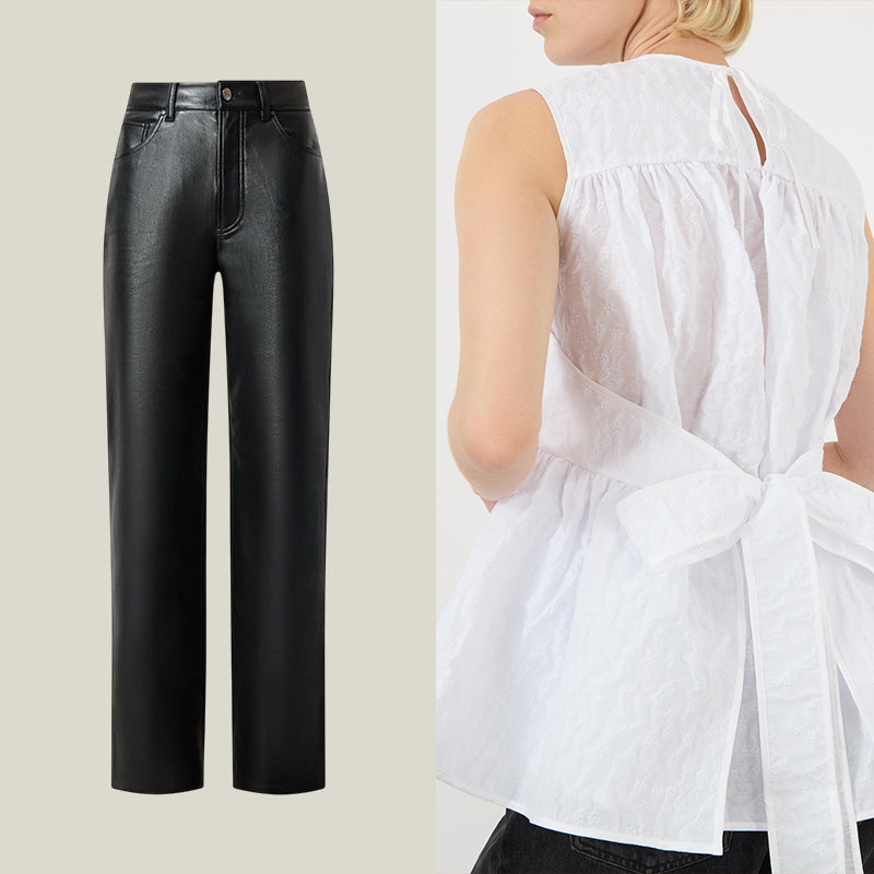 Black leather pants shown with a back view of a tied white sleeveless blouse.