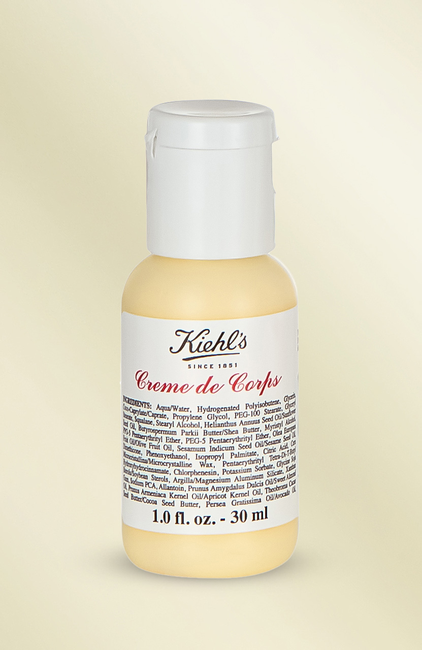 A small bottle of Kiehl's Creme de Corps lotion, 1.0 fl. oz (30 ml), with an ingredient list on the label.