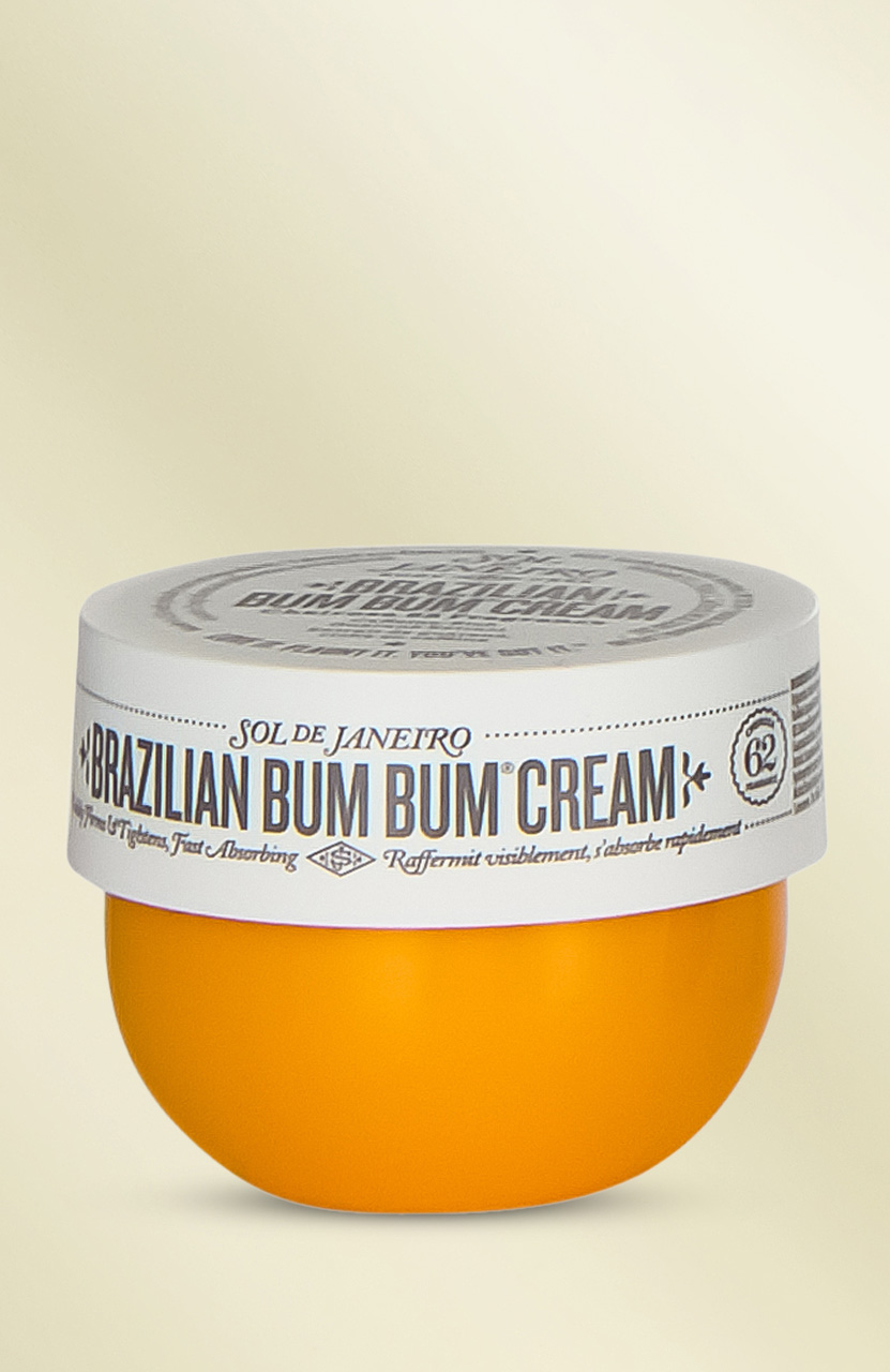 Orange and white jar of Sol de Janeiro Brazilian Bum Bum Cream on an off-white background.