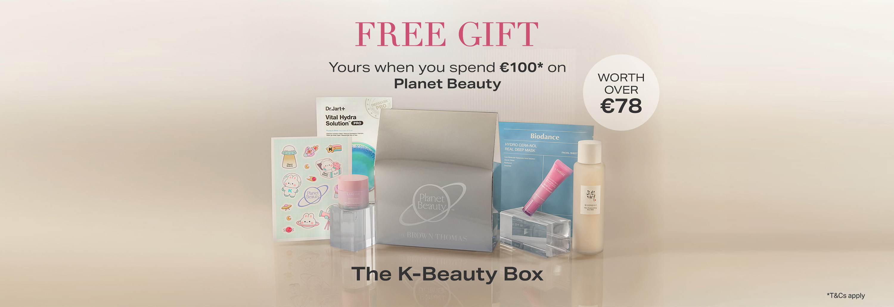 Advertisement for a free K-Beauty Box gift with a purchase of €100 on Planet Beauty. Box includes skincare and makeup items, valued over €78.