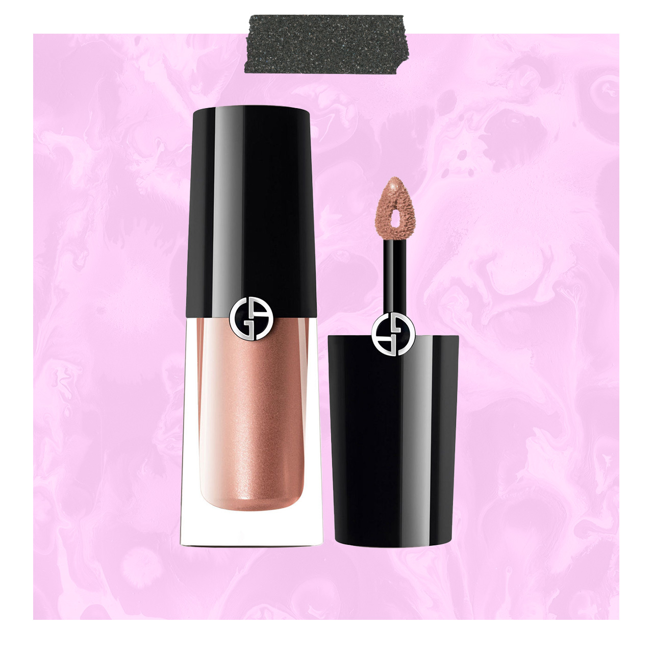 Black cylindrical liquid eyeshadow bottles with shimmer finish and applicator wands on pink textured background