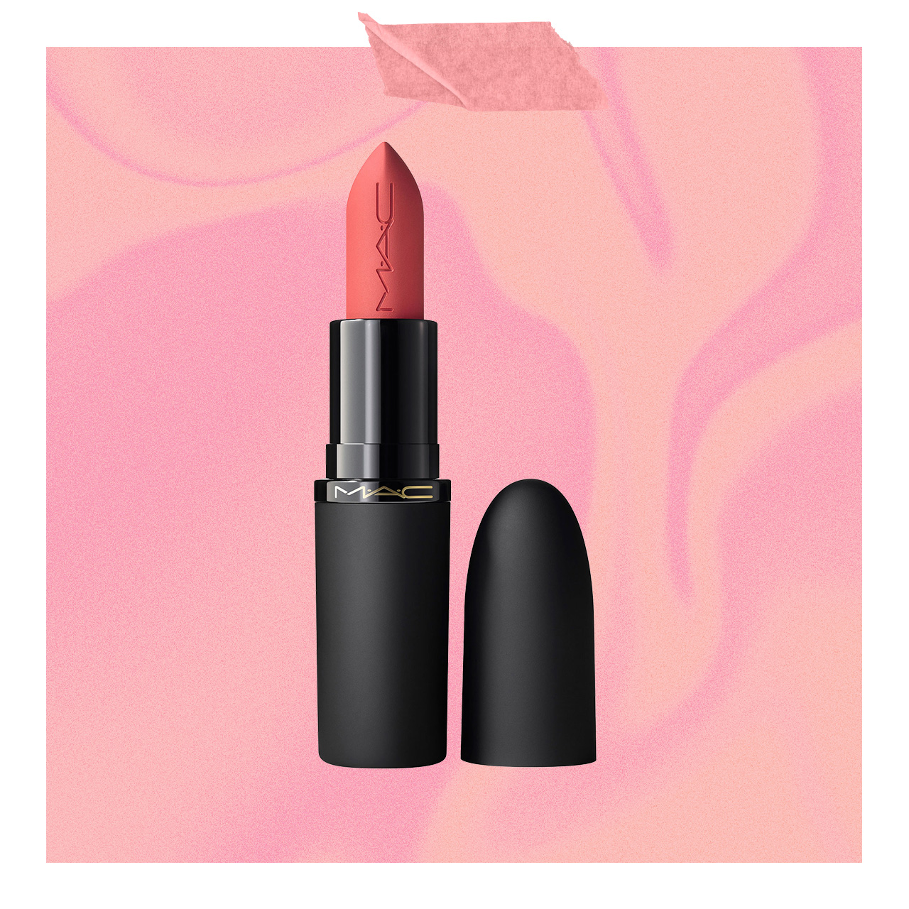 Red lipstick with black tube and matching cap on soft pink gradient background