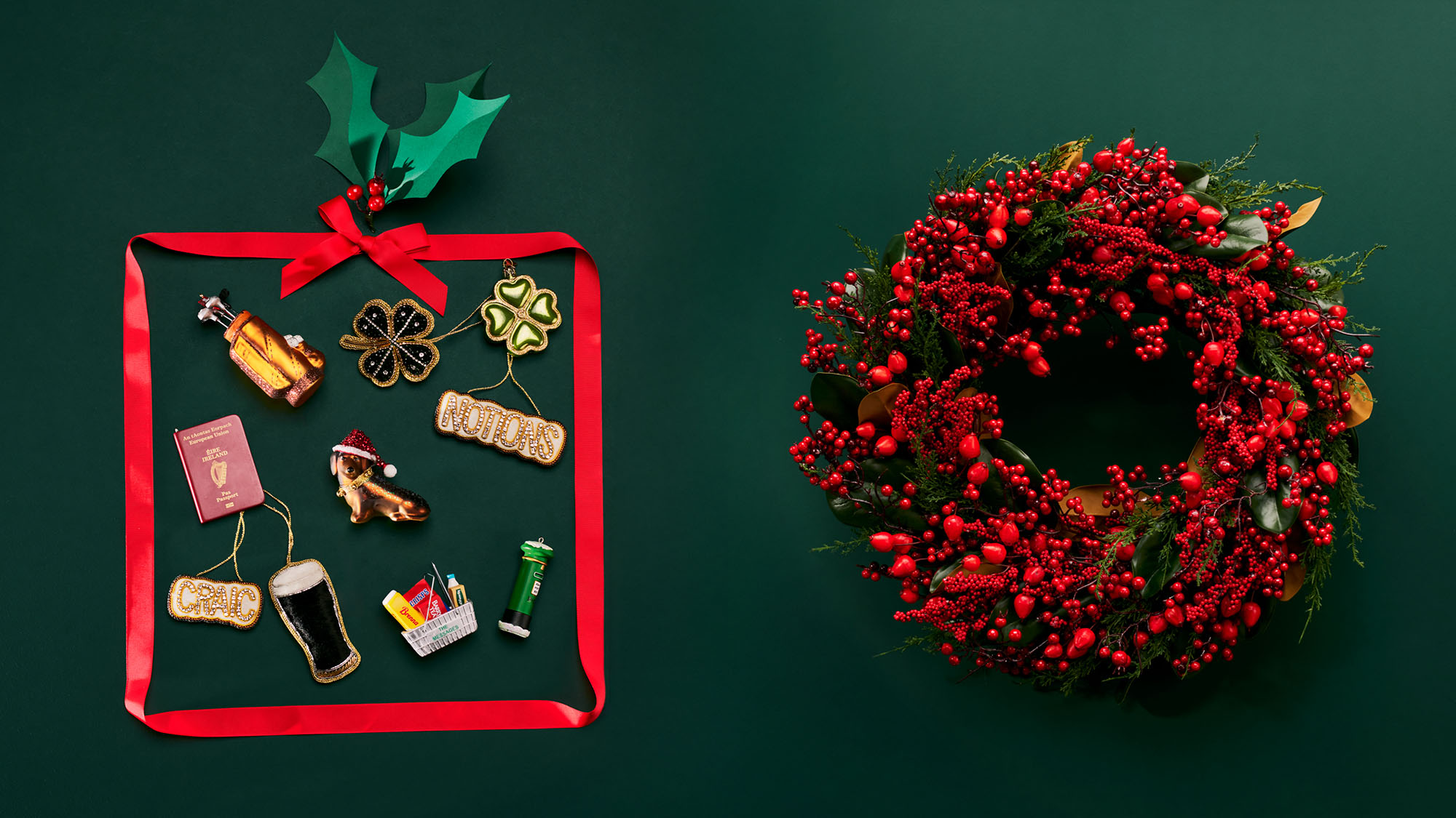 A Christmas wreath with red berries on the right; festive ornaments including a pint, a present, and a clover, arranged inside a red ribbon square on the left.