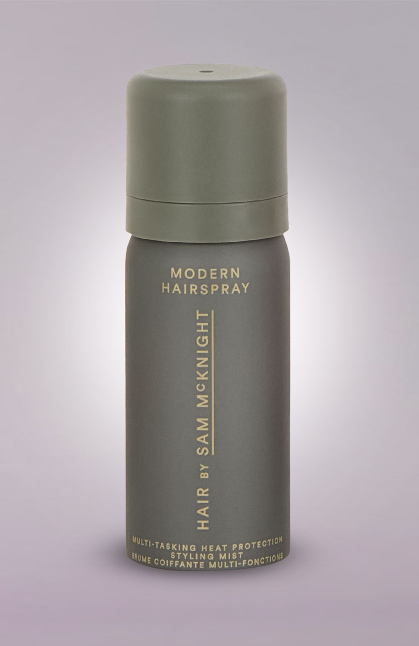 Gray cylindrical hairspray can with 'Modern Hairspray' and 'Hair by Sam McKnight' text.