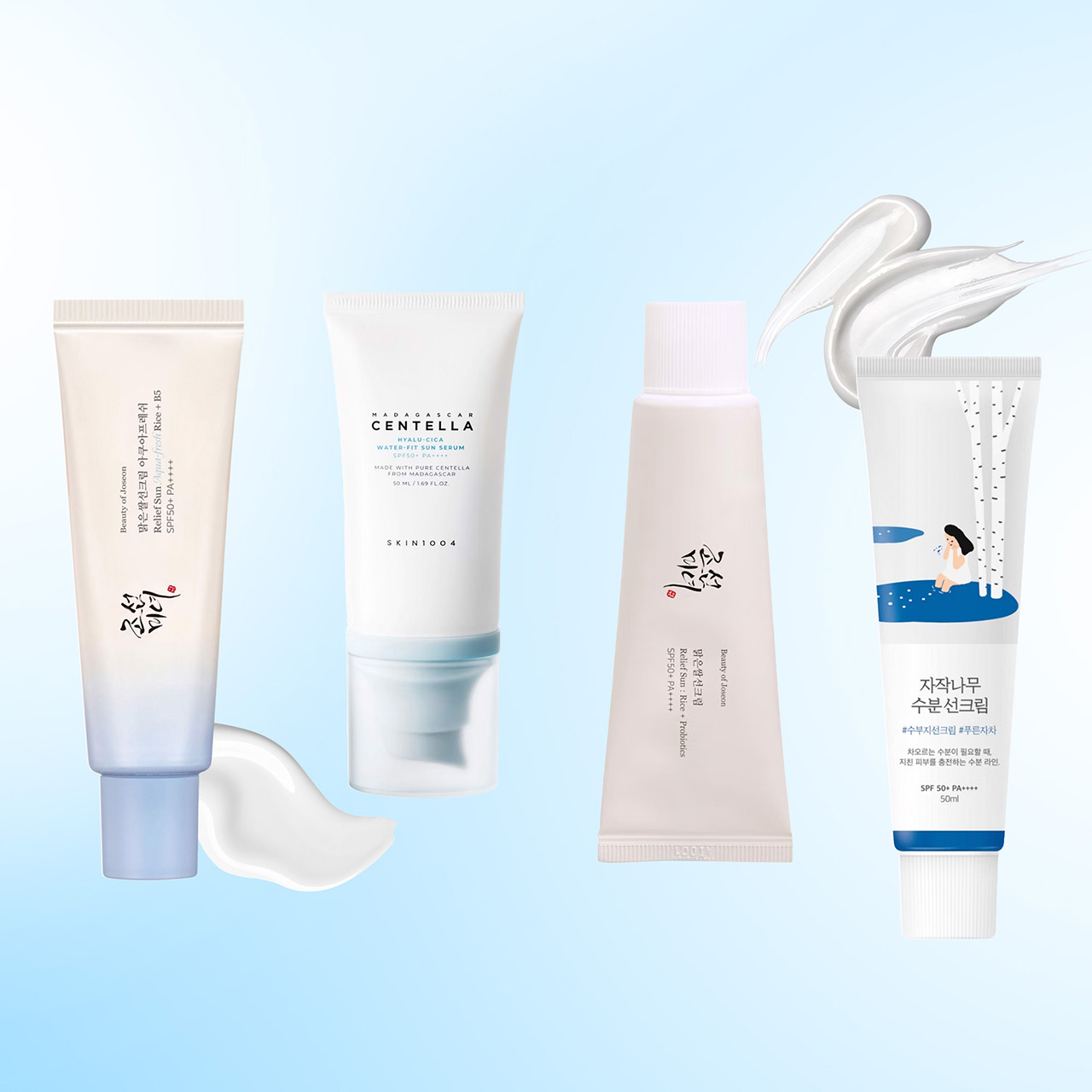 Four Korean skincare sun care products displayed on a light blue background, including tubes and bottles with SPF protection formulas