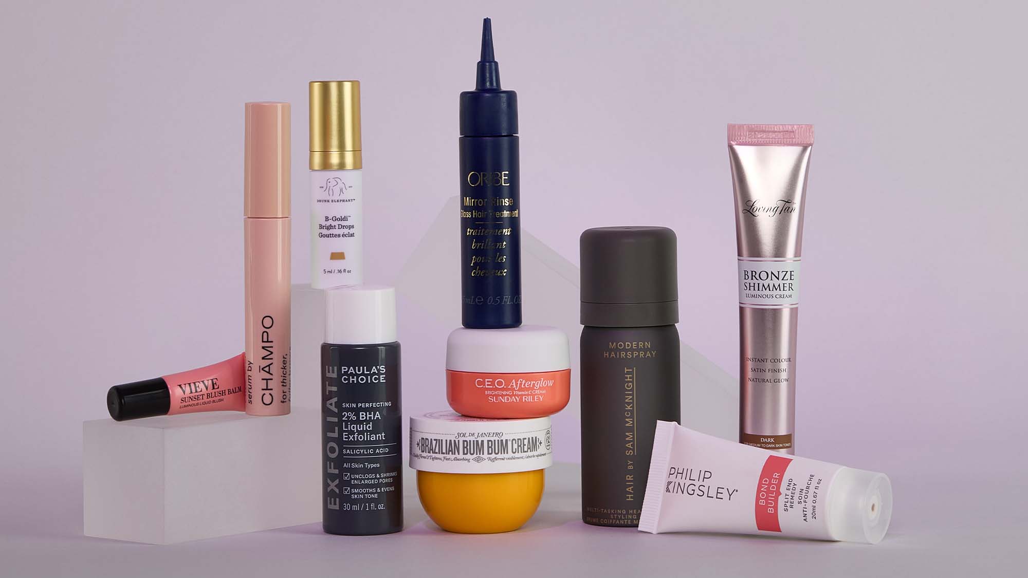 A collection of skincare and beauty products, including creams, serums, and lotions, arranged on a light surface.