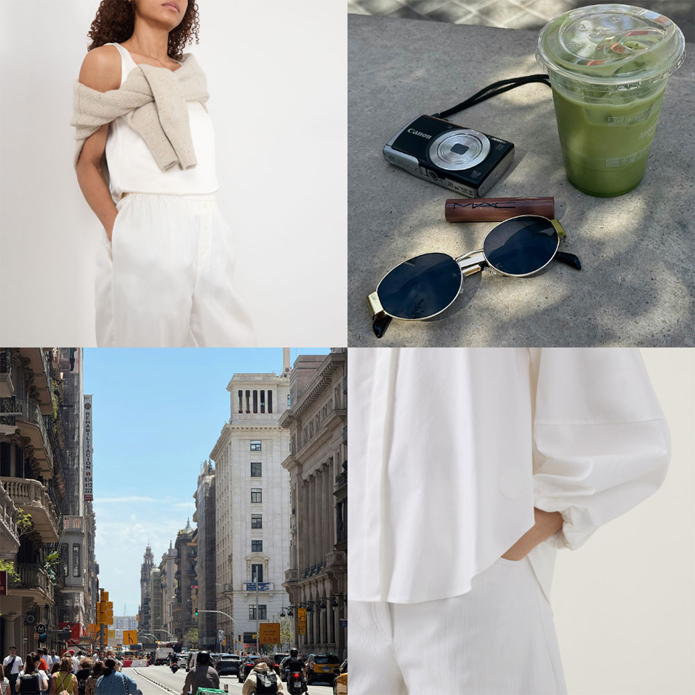 Woman in white sleeveless top and wide-leg trousers with beige cardigan, sunglasses, camera and green drink on sunny street.