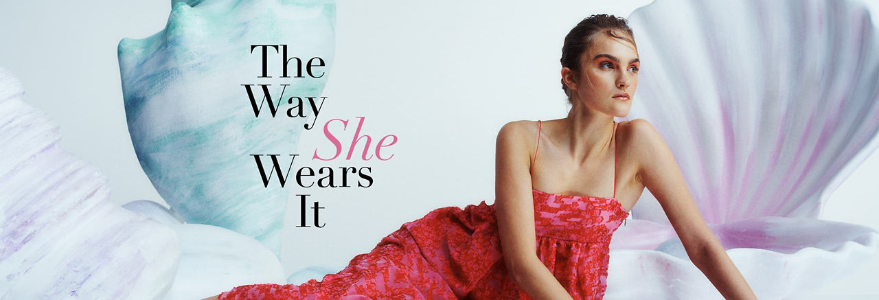 woman in red dress with title 'The Way She Wears It' overlaid'