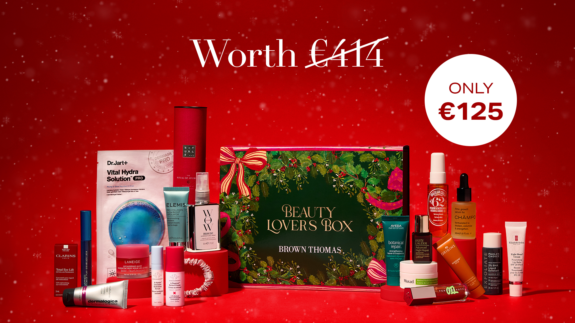 A promotional image for a 'Beauty Lovers Box' displaying various skincare and cosmetic products on a red background.