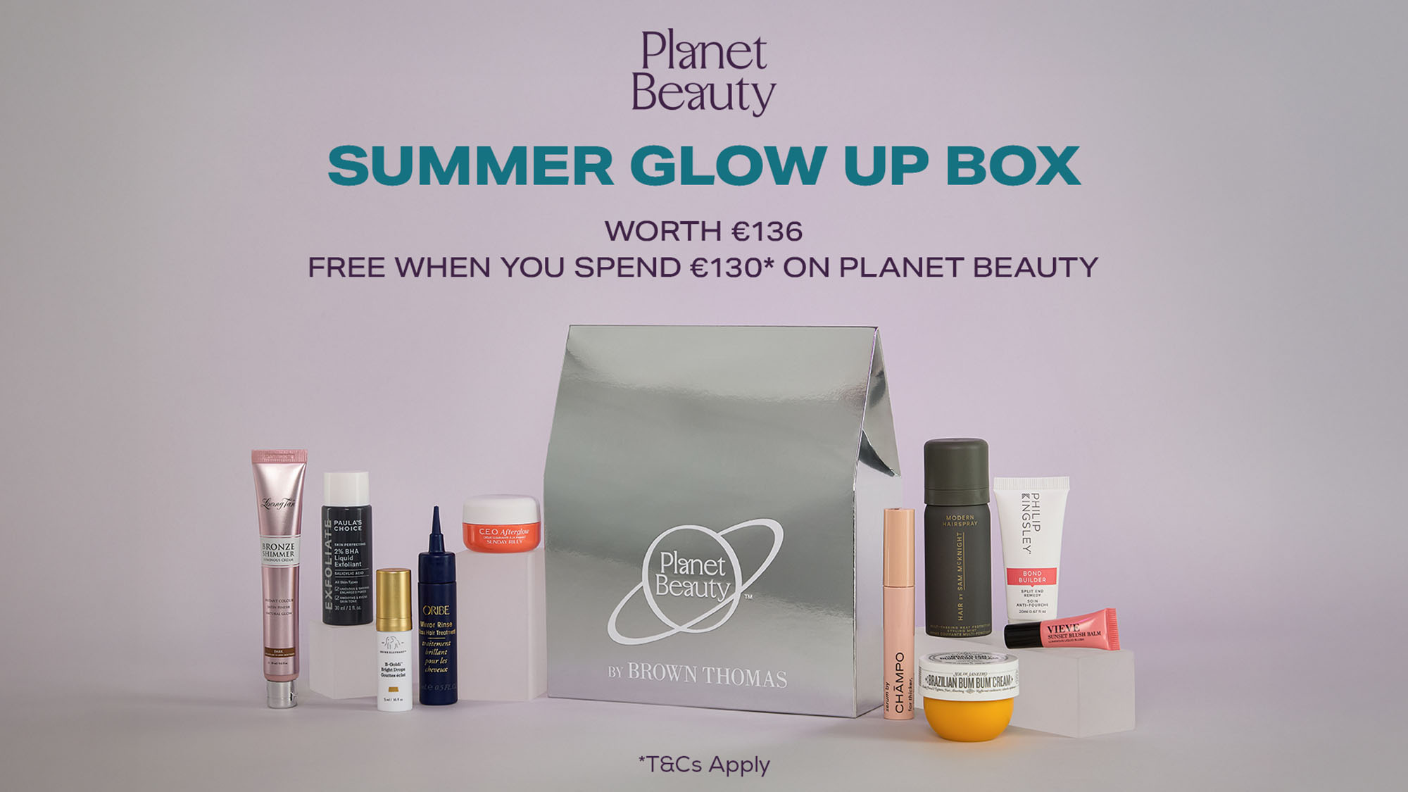 A collection of beauty products displayed around a metallic gift bag labeled 'Planet Beauty Summer Glow Up Box.' Offers details above the bag.