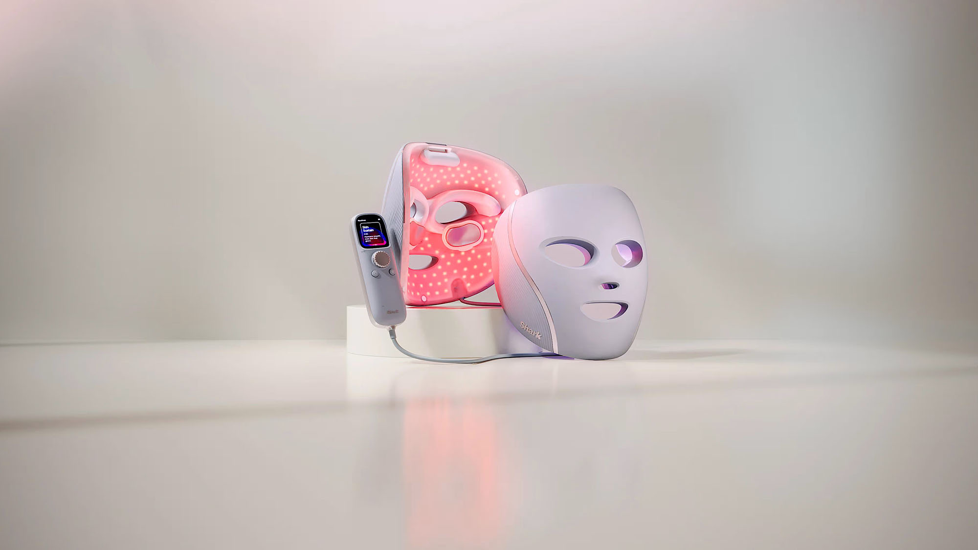 The shark cryoglow face mask with a plain background