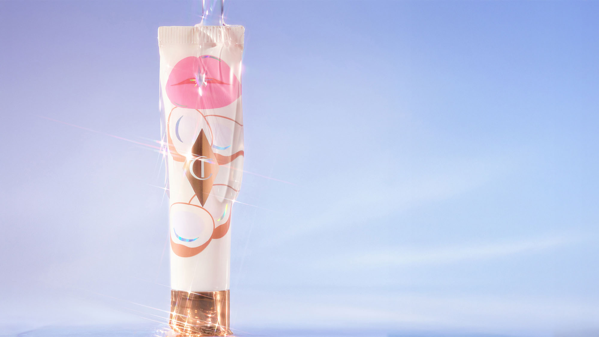 A white cosmetic tube with a metallic cap and abstract face design on a light blue background, surrounded by sparkling light effects.