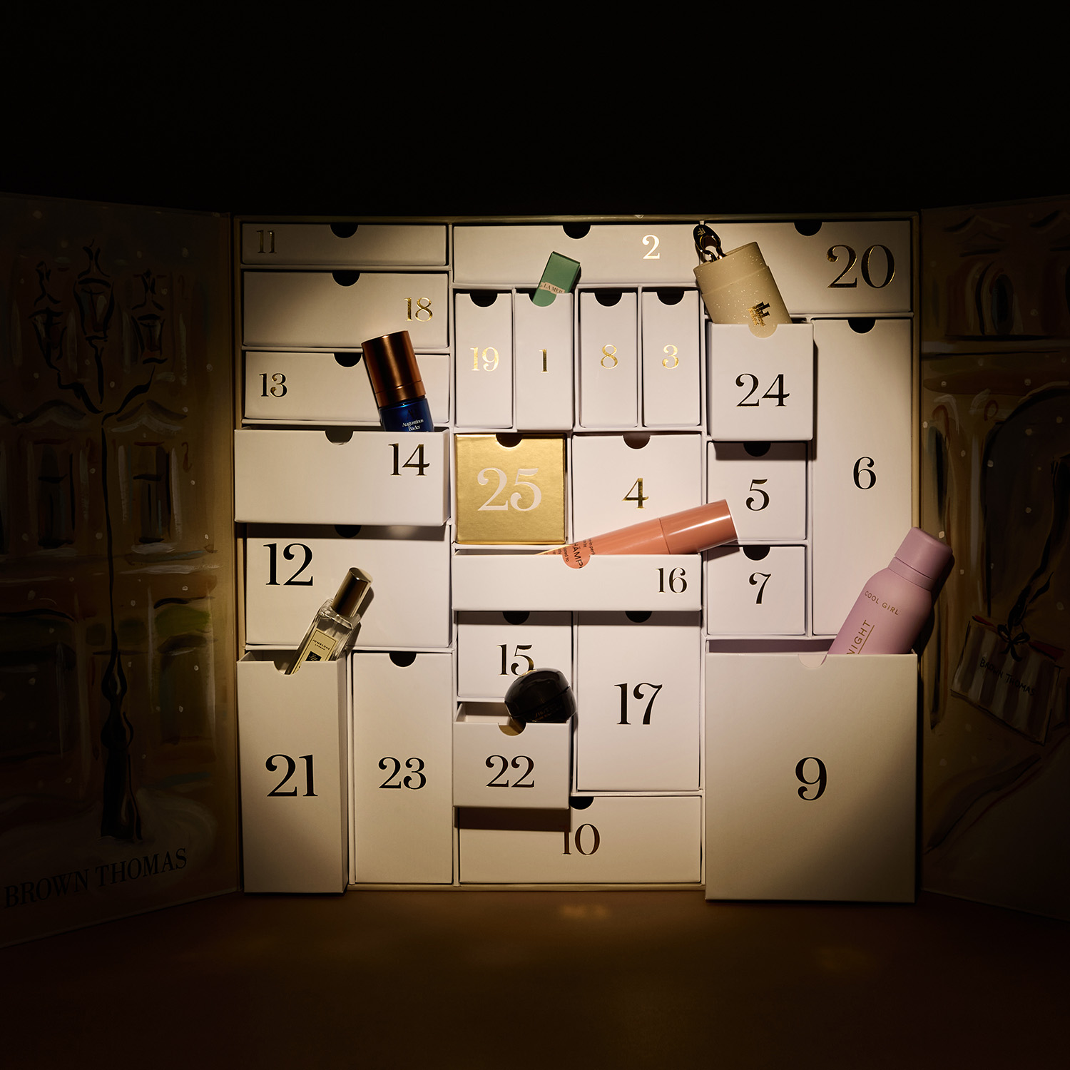 A decorative advent calendar with numbered compartments, some open revealing beauty products.