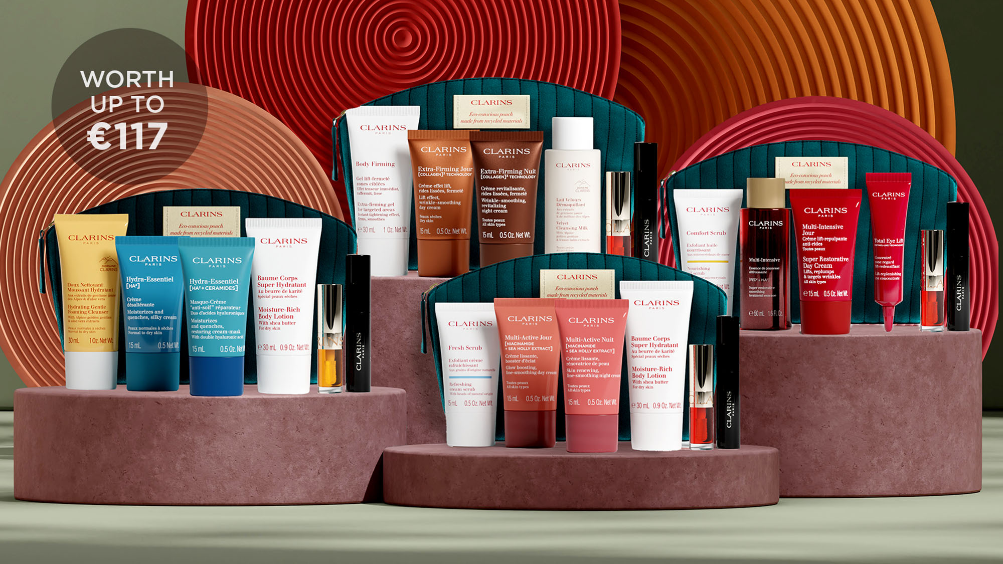 Display of Clarins skincare and cosmetic products on circular stands with patterned backdrops.
