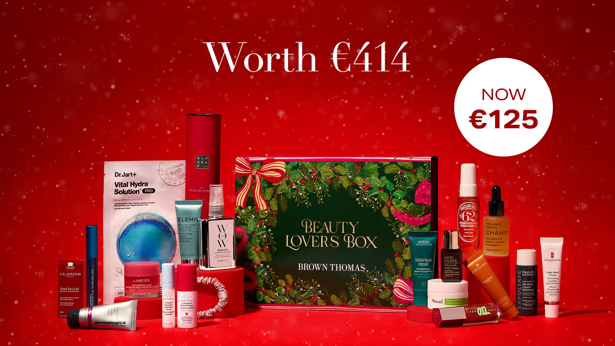 A promotional image for a 'Beauty Lovers Box' displaying various skincare and cosmetic products on a red background.