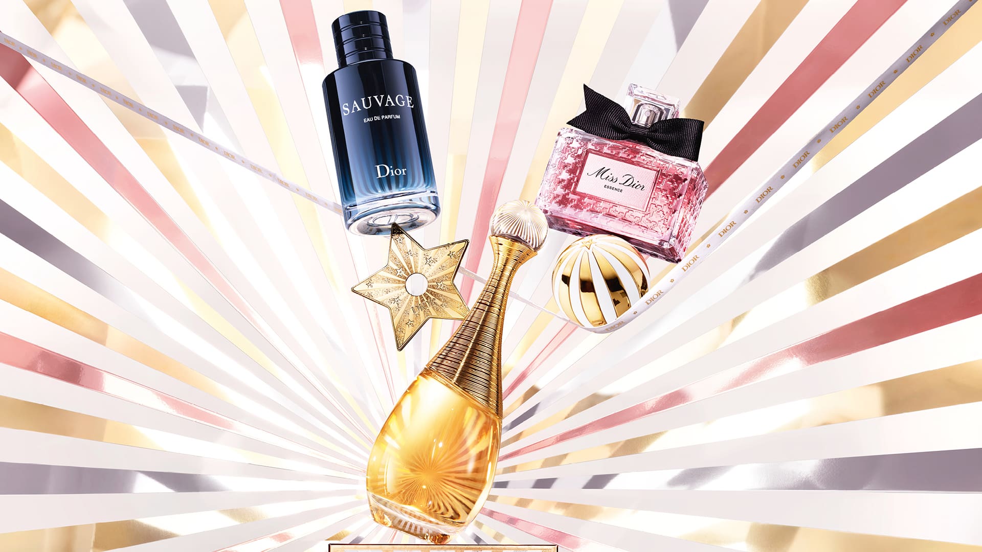 Three perfume bottles are creatively arranged with a starburst background, featuring elegant design elements.