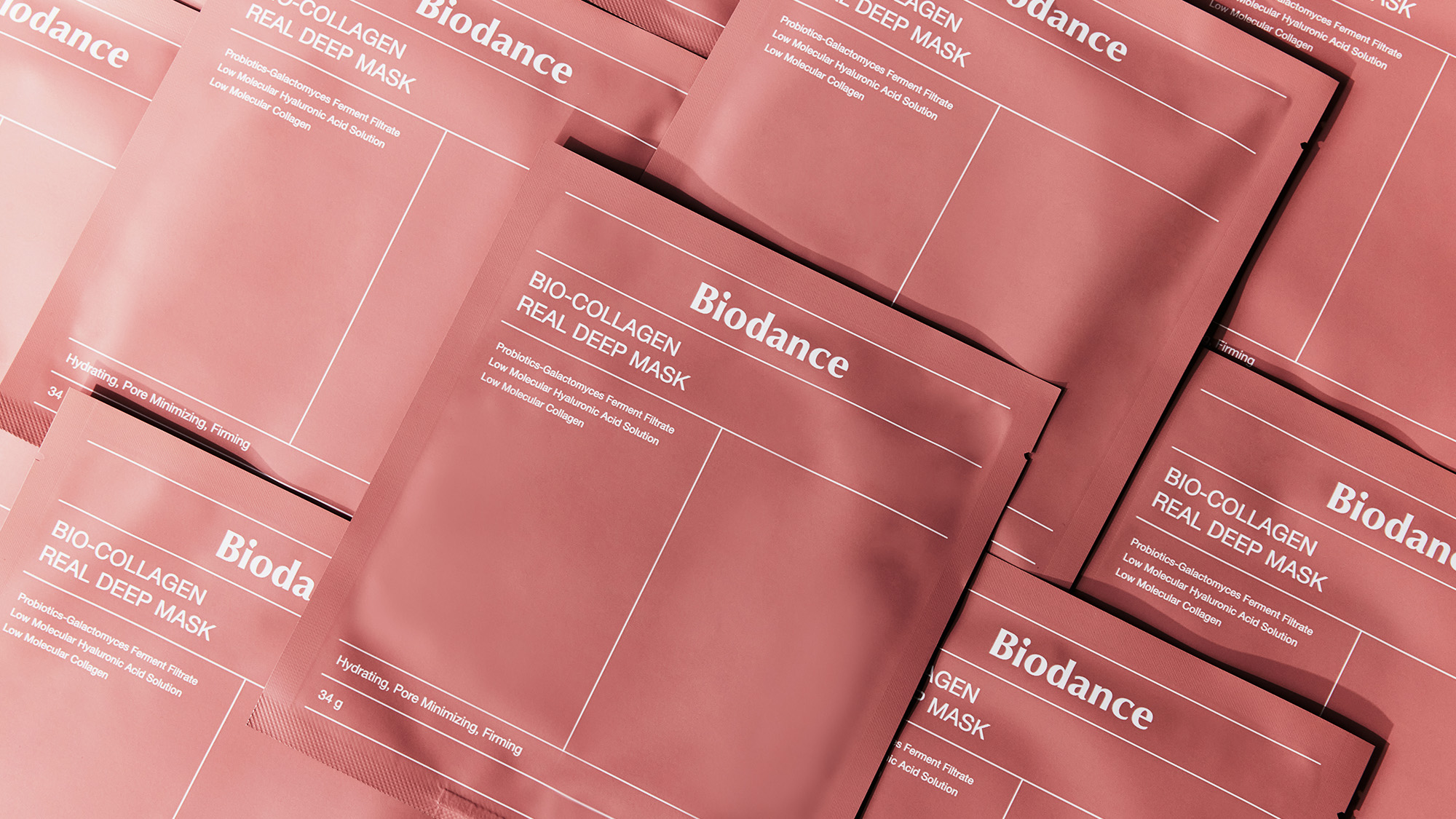 Overlapping packets of Biodance Bio-Collagen Real Deep Mask, arranged in a pattern.