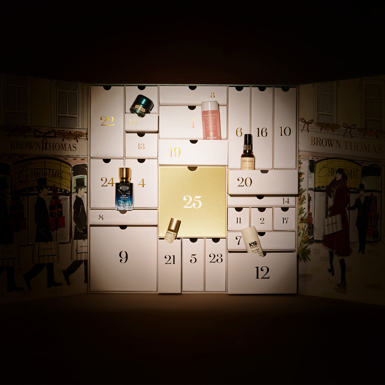 Black luxury shopping bag with Brown Thomas branding and soft spotlight lighting
