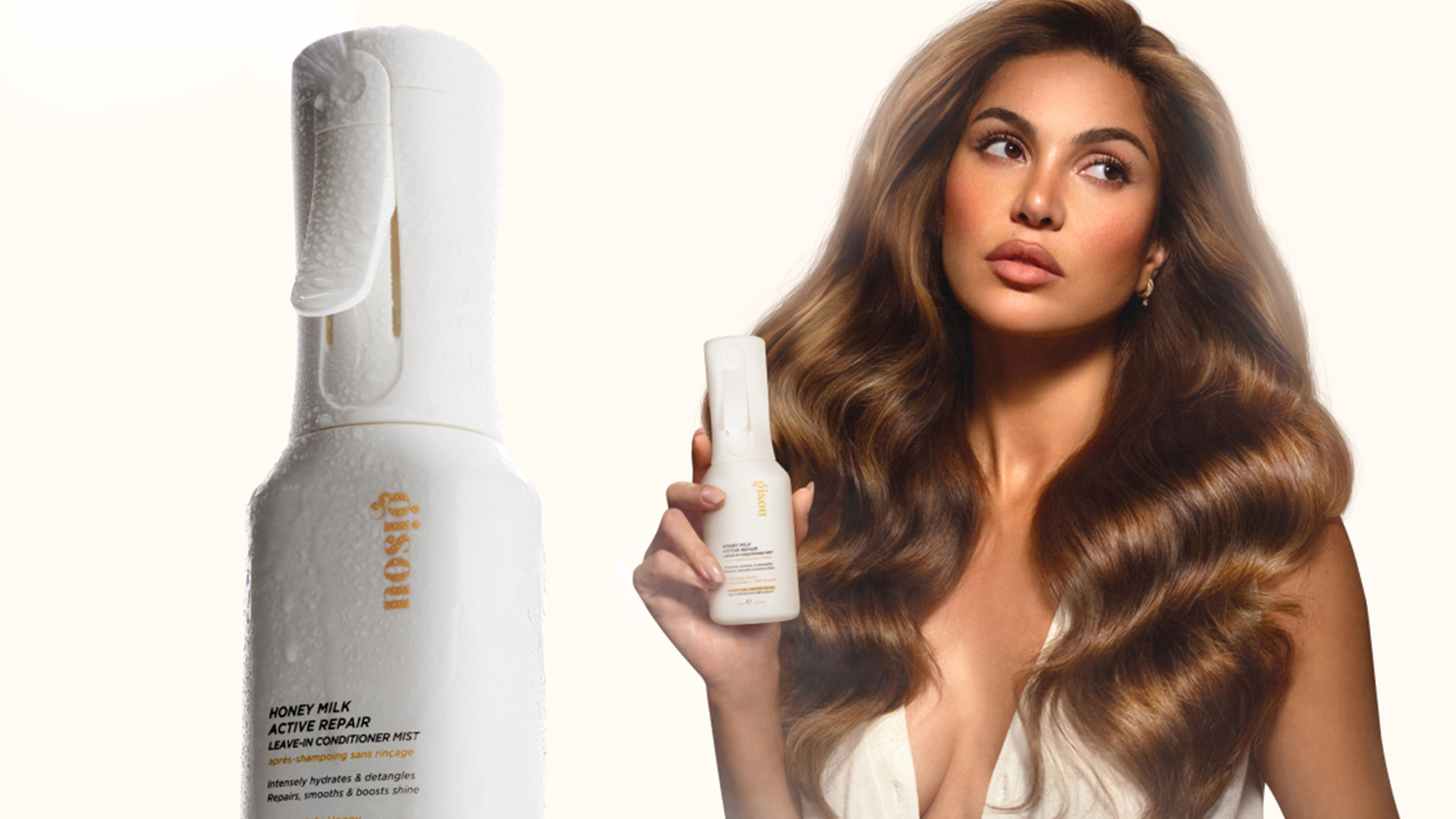 A woman with voluminous hair holds a 'Gisou' hair product bottle, with another bottle displayed prominently on the left.