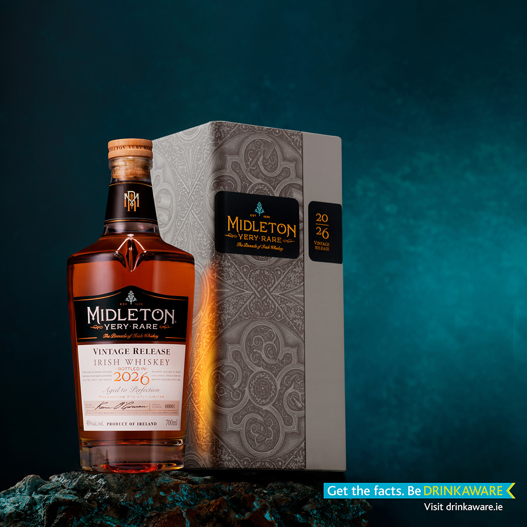 Midleton Very Rare 2026 Irish whiskey bottle with decorative gift box on teal rocky surface