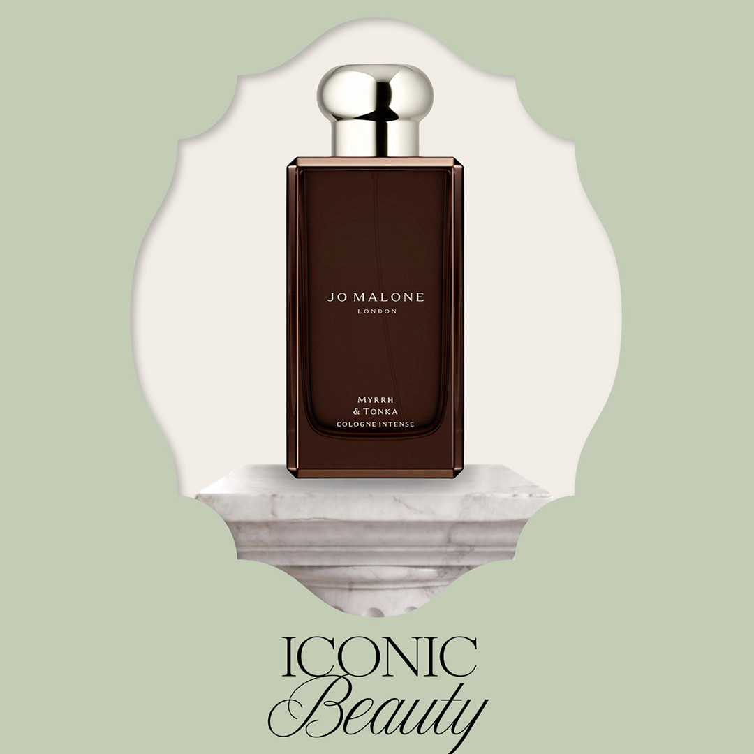 Jo Malone London Myrrh & Tonka Cologne Intense fragrance bottle on marble pedestal against pale green background