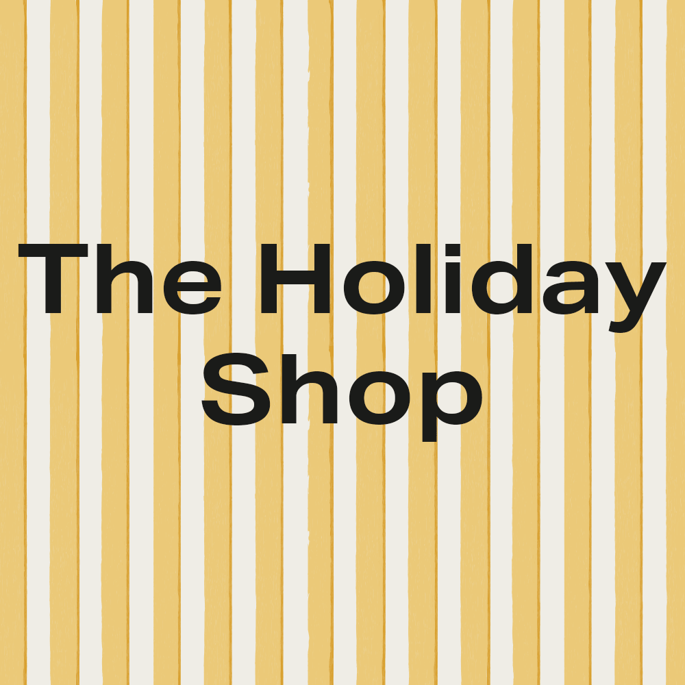 Text 'The Holiday Shop' on a background of vertical yellow and white stripes.