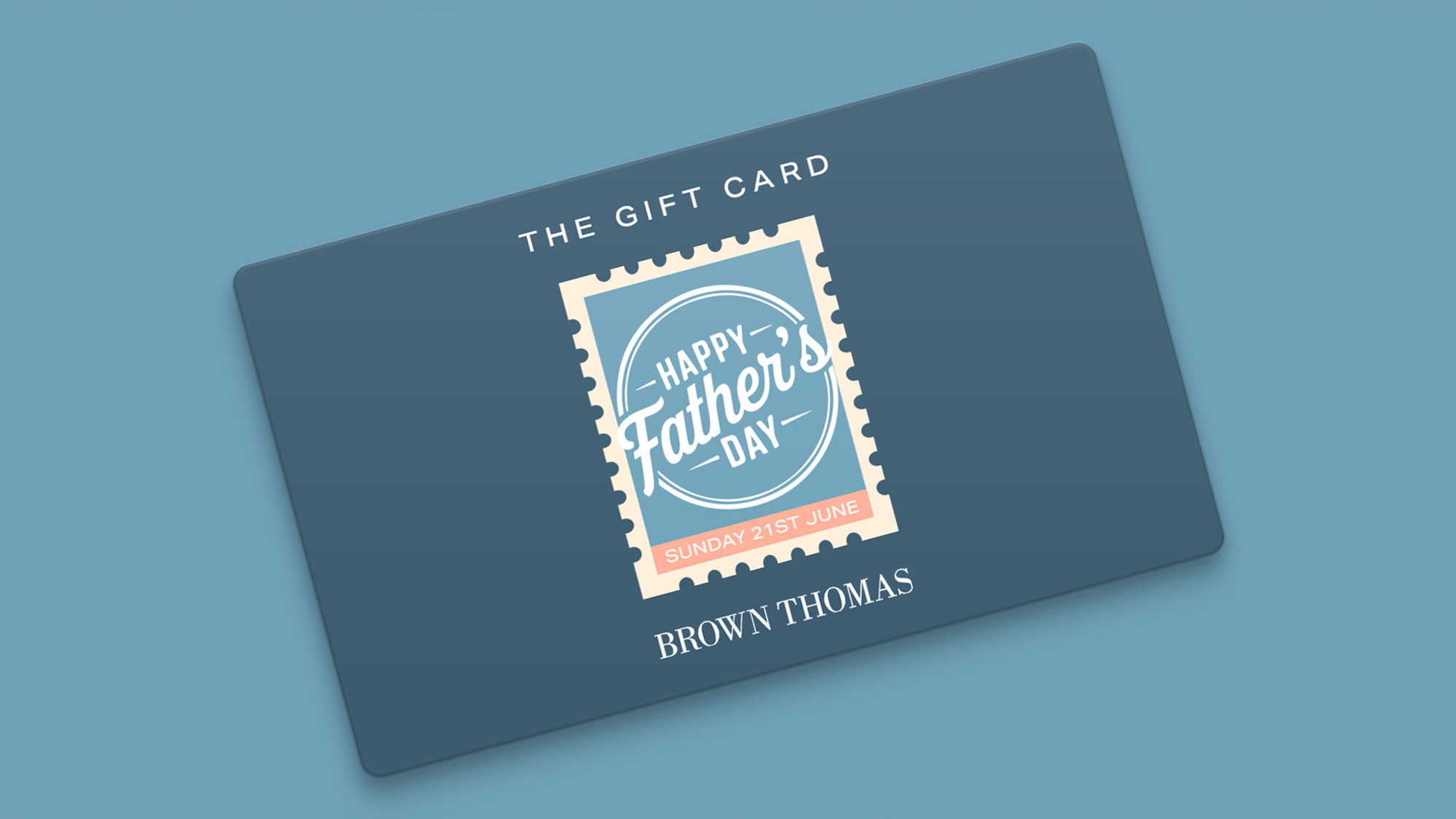 Dark blue gift card featuring Happy Father's Day stamp design, Sunday 21st June, Brown Thomas branding