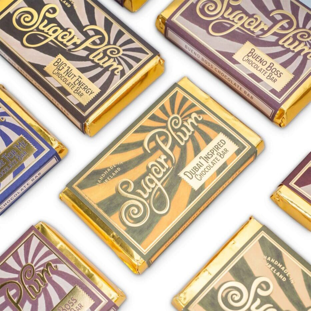 Sugar Plum Dublin-inspired chocolate bars with vintage-style packaging in gold and cream tones
