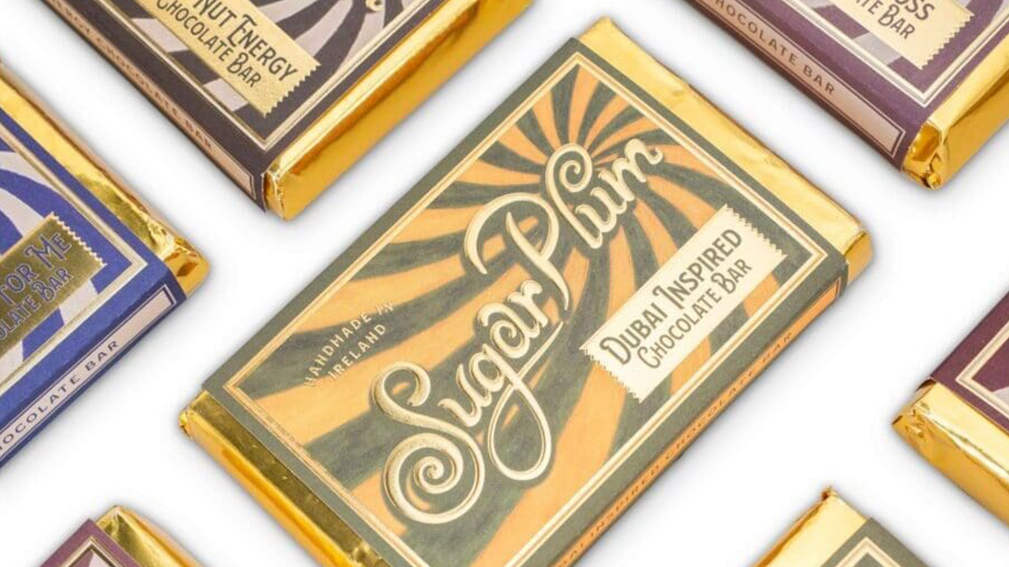 Sugar Plum Dublin-inspired chocolate bars with vintage-style packaging in gold and cream tones