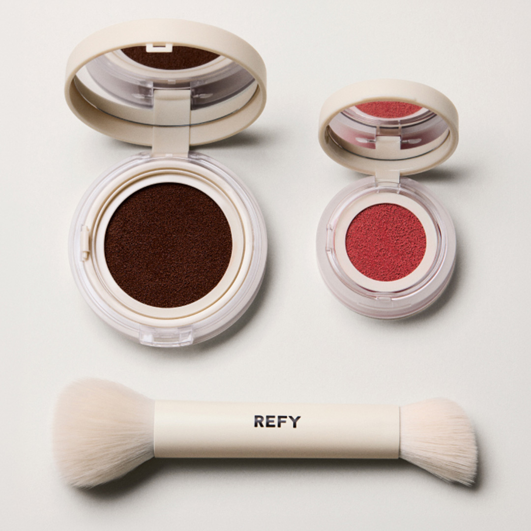 REFY cream eyeshadow in deep brown and coral red with dual-ended brush applicator