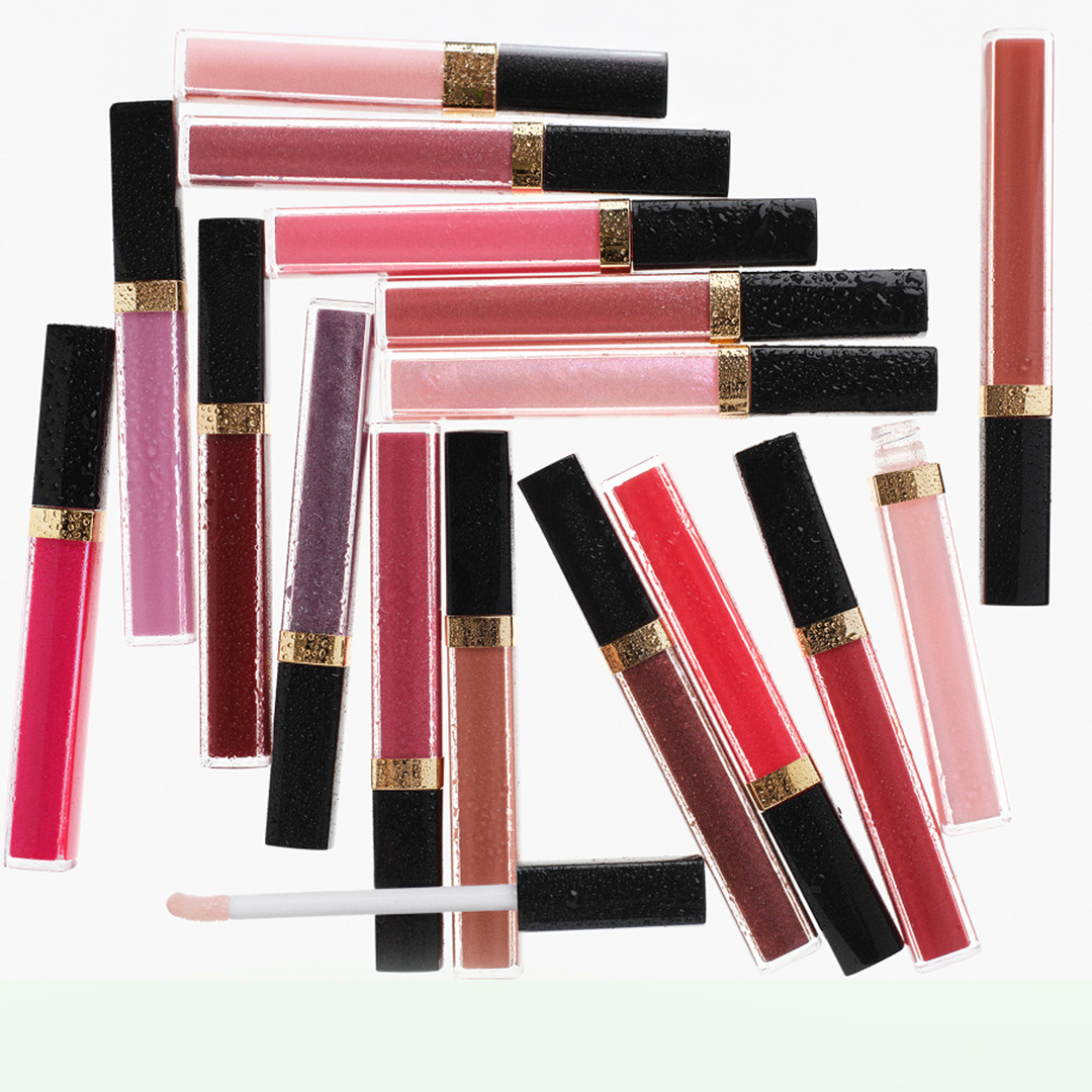 Collection of CHANEL Coco Rouge lipsticks and lip glosses in assorted shades from pink to burgundy with gold trim