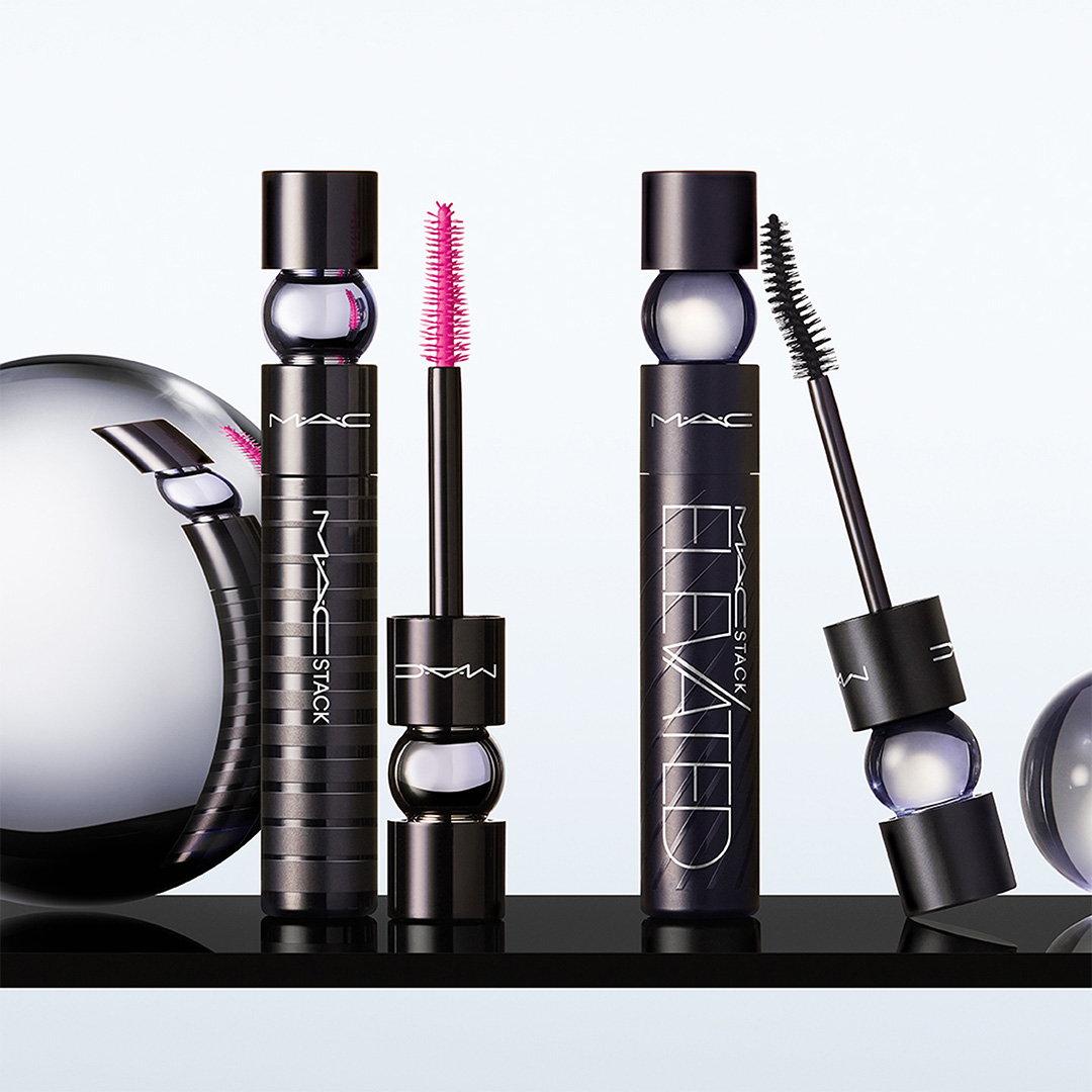 Eye makeup collection featuring mascaras in pink and black with eyeshadow palettes and application brushes