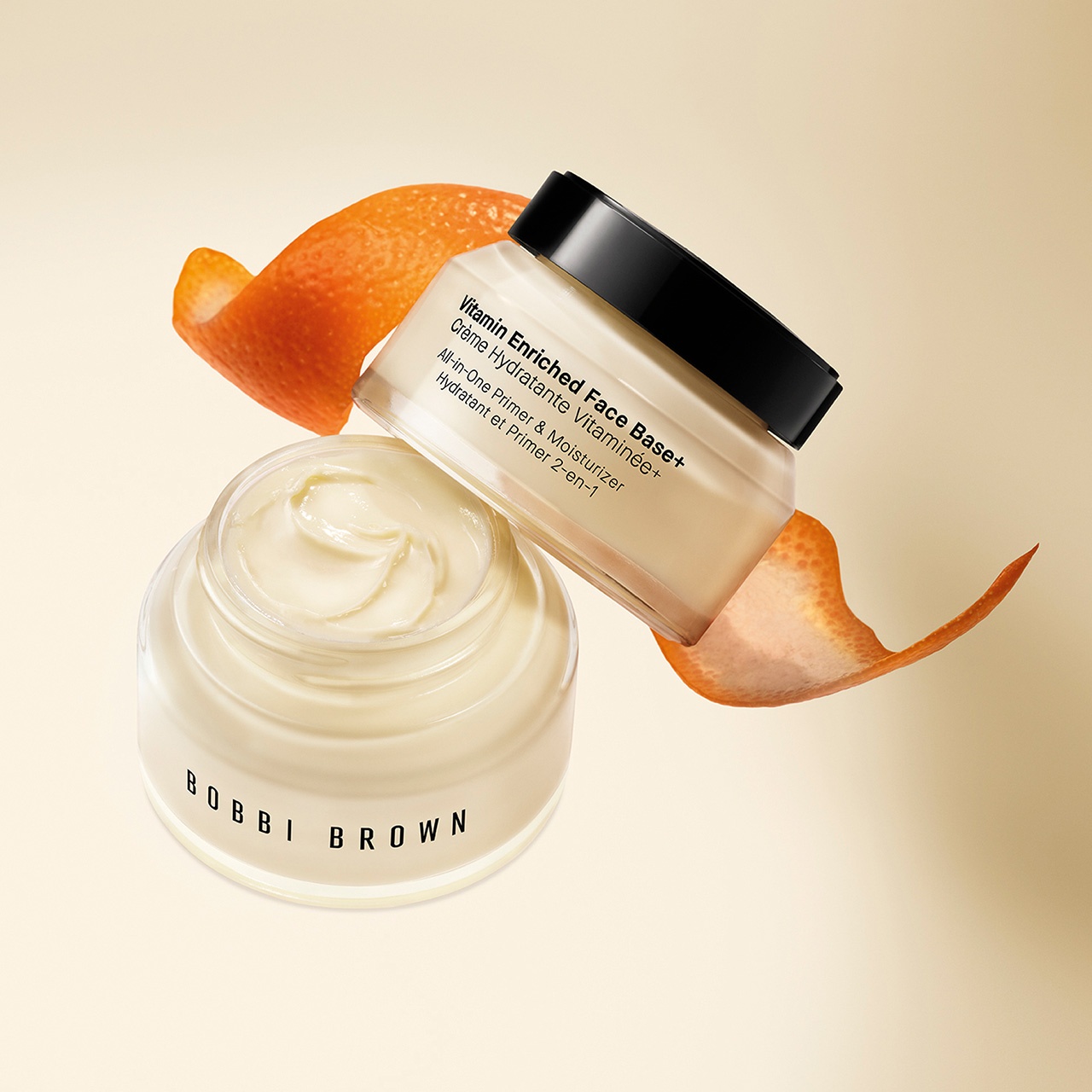 Range of Bobbi Brown SuperVitamin Blend lip products in varying nude and berry shades with white cylindrical tubes