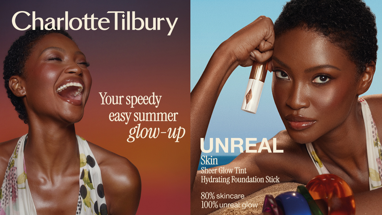 Woman with glowing skin holding Unreal Skin Sheer Glow Tint Hydrating Foundation Stick against blue background
