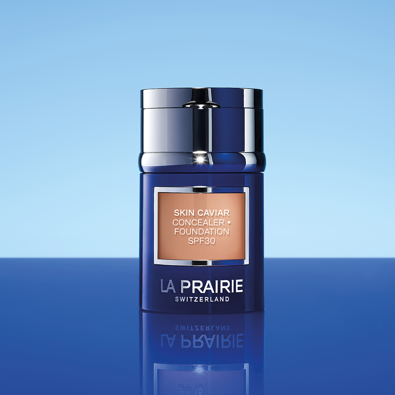 La Prairie Skin Caviar Concealer Foundation SPF30 in dark blue bottle against blue background